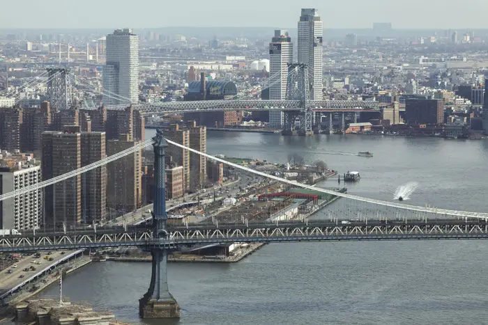 The Manhattan and Williamsburg bridges seen over the East River in New York City on February 12, 2024